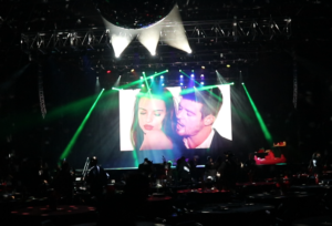 Large video screen at the Bomb Factory showing Robin Thicke and Emily Ratajkowski in the “Blurred Lines” music video during a live video DJ performance.