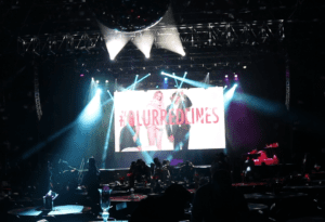 DJ playing Robin Thicke’s “Blurred Lines” on a giant screen at the Bomb Factory in Dallas during a live music video DJ performance.