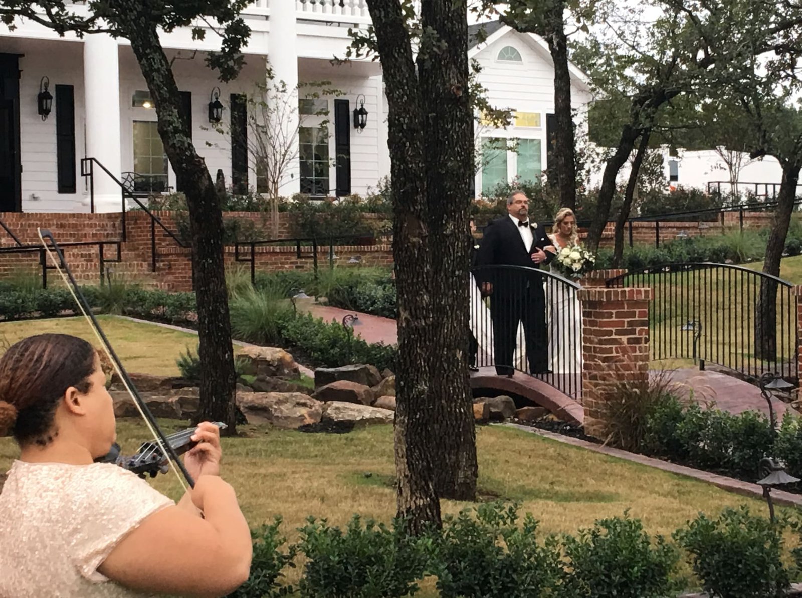 musician playing for a bride and groom at a wedding ceremony