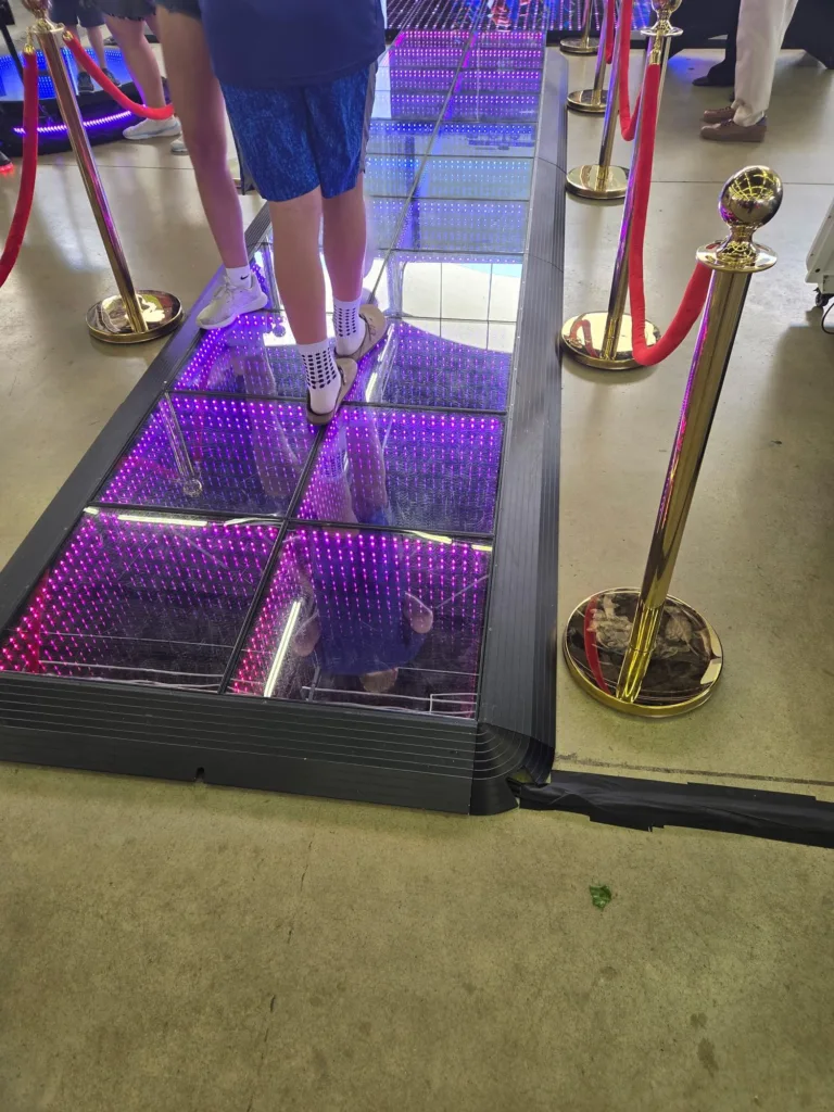 Infinity mirror LED dance floor with purple lighting in Dallas
