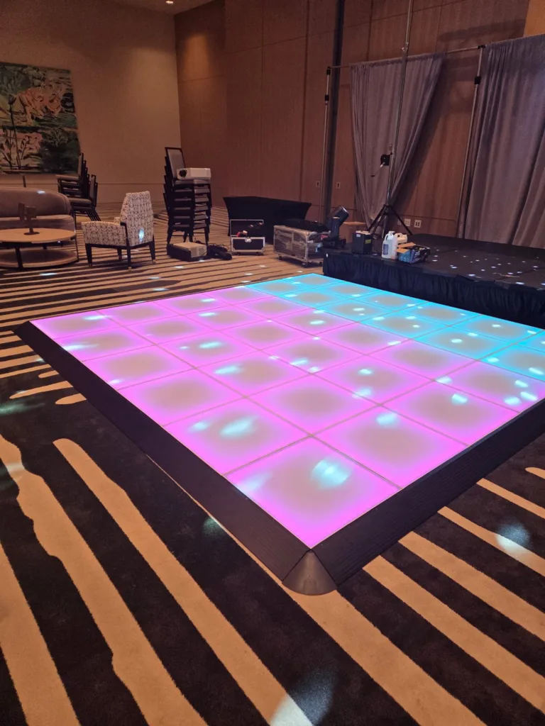 Pink and aqua LED dance floor installed in a Dallas hotel ballroom